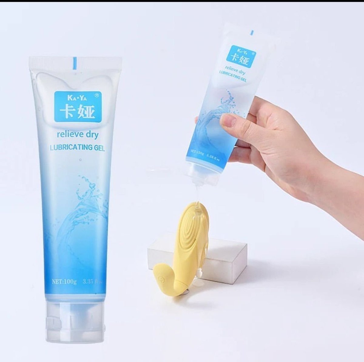 Three personal lubricating gel products displayed: a blue tube, a compact tube being held by a hand, and a yellow applicator with white packaging