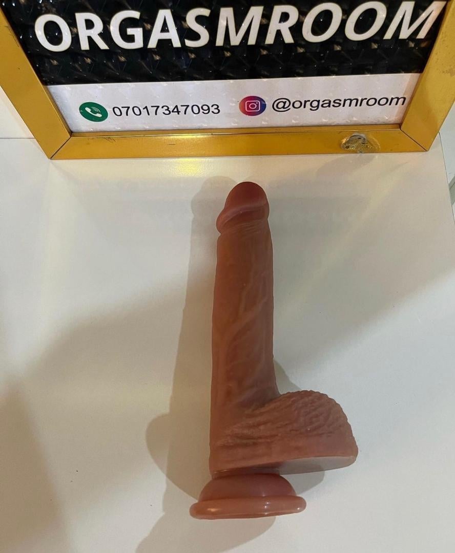 Product display photo showing a red silicone adult toy in packaging labeled OrgasmRoom with contact information