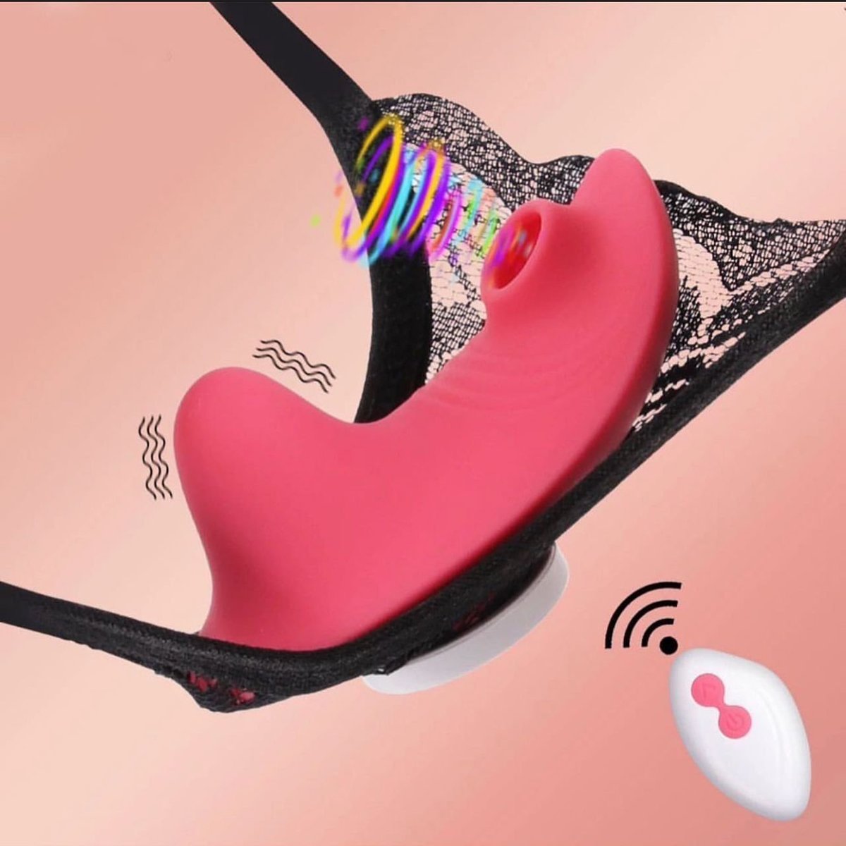 Pink silicone vibrator with remote control on pink background, featuring colorful bracelets and black sparkly fabric