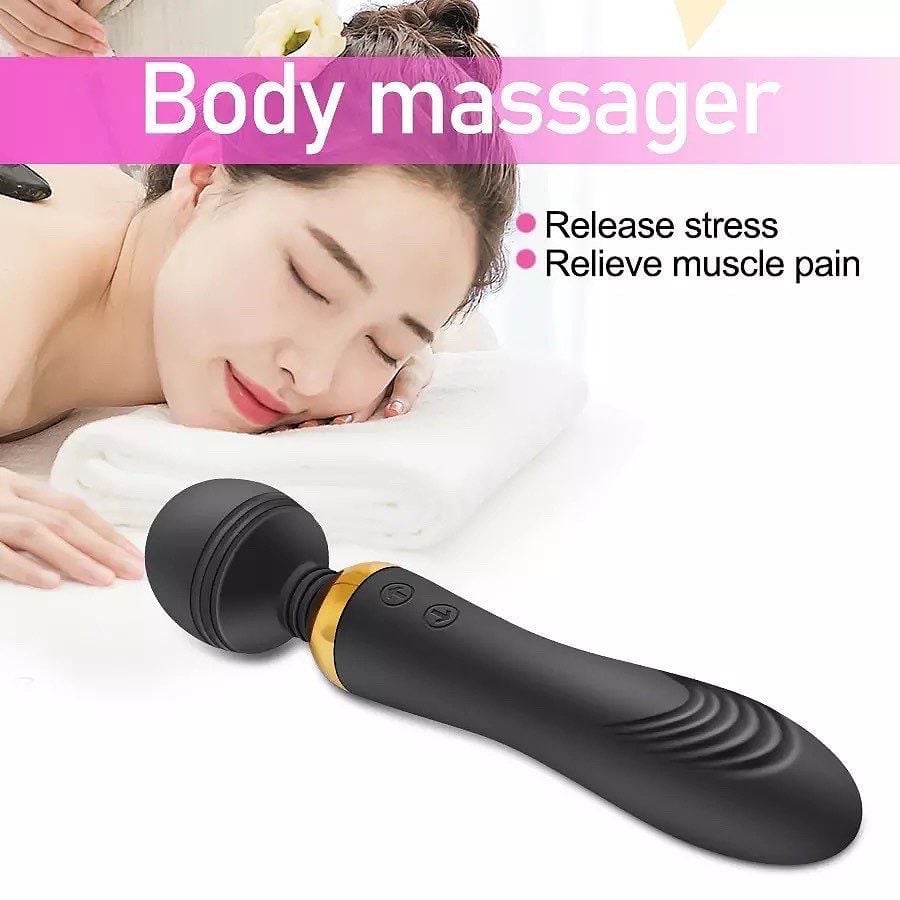 Woman relaxing with black wand body massager, product shown for stress relief and muscle pain